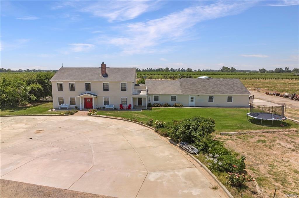 large two story farmhouse, large yard and agricultural fields